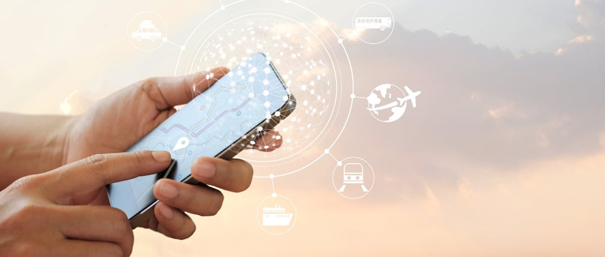 Hand with cell phone and travel network symbols